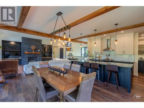 8660 Riverside Drive, Grand Forks, BC - Indoor Photo Showing Dining Room With Fireplace