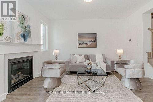 1704 Dance Court, Milton (Bowes), ON - Indoor Photo Showing Living Room With Fireplace