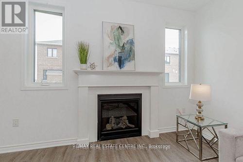 1704 Dance Court, Milton (Bowes), ON - Indoor Photo Showing Living Room With Fireplace