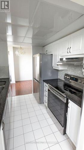 305 - 550 Webb Drive, Mississauga, ON - Indoor Photo Showing Kitchen With Double Sink