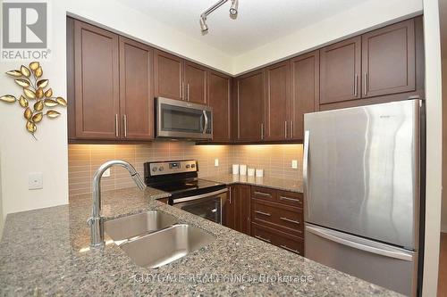 1110 - 3975 Grand Park Drive E, Mississauga, ON - Indoor Photo Showing Kitchen With Stainless Steel Kitchen With Double Sink With Upgraded Kitchen