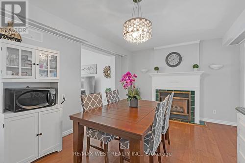 7710 Jubilee Drive, Niagara Falls, ON - Indoor Photo Showing Dining Room With Fireplace