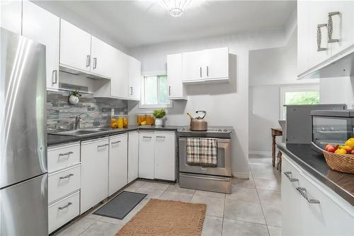 Virtually Staged - 15 Agnes Street, Hamilton, ON - Indoor Photo Showing Kitchen With Double Sink