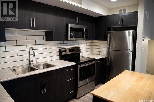 105 3367 Green Poppy Street, Regina, SK - Indoor Photo Showing Kitchen With Stainless Steel Kitchen With Double Sink With Upgraded Kitchen