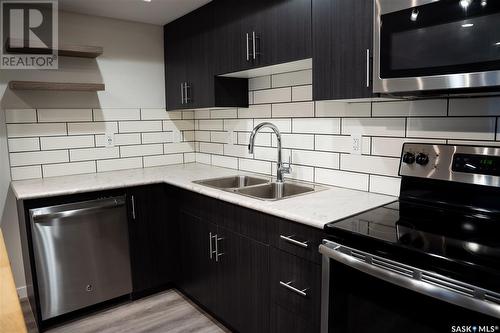 105 3367 Green Poppy Street, Regina, SK - Indoor Photo Showing Kitchen With Stainless Steel Kitchen With Double Sink With Upgraded Kitchen