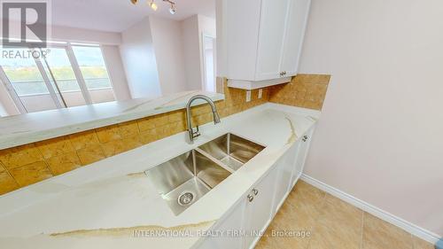 304 - 710 Humberwood Boulevard, Toronto, ON - Indoor Photo Showing Kitchen With Double Sink