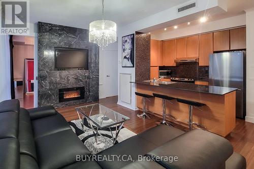 905 - 30 Canterbury Place E, Toronto, ON - Indoor Photo Showing Living Room With Fireplace