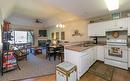 318-1002 Riverside Avenue, Sicamous, BC  - Indoor Photo Showing Kitchen With Fireplace With Double Sink 