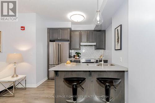 602 - 58 Adam Sellers Street, Markham (Cornell), ON - Indoor Photo Showing Kitchen With Double Sink