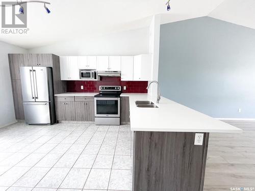 3 3472 Fairlight Drive, Saskatoon, SK - Indoor Photo Showing Kitchen With Double Sink