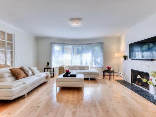 Living room - 2025 Ch. Kildare, Mont-Royal, QC - Indoor Photo Showing Living Room With Fireplace