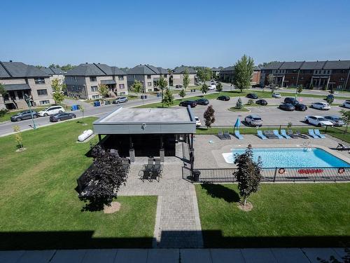 Overall view - 307-959 Rue Jules-Huot, Laval (Chomedey), QC - Outdoor With In Ground Pool With View