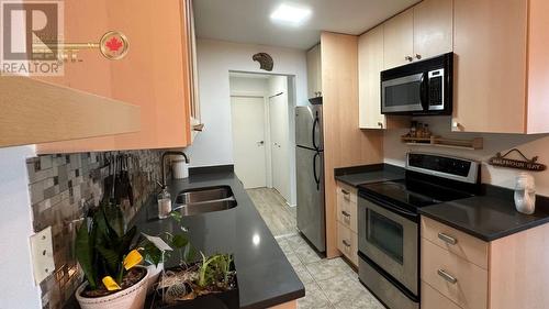 209 809 W 16Th Street, North Vancouver, BC - Indoor Photo Showing Kitchen With Stainless Steel Kitchen With Double Sink