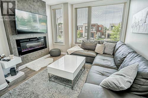 129 Stanley Greene Boulevard, Toronto (Downsview-Roding-Cfb), ON - Indoor Photo Showing Living Room With Fireplace