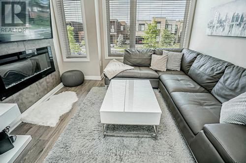 129 Stanley Greene Boulevard, Toronto (Downsview-Roding-Cfb), ON - Indoor Photo Showing Living Room With Fireplace