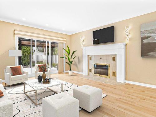 Family room - 10 Rue Beaubois, Kirkland, QC - Indoor Photo Showing Living Room With Fireplace