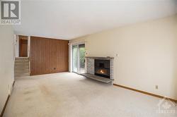 Living room features electric insert fireplace with sliding doors to deck - 