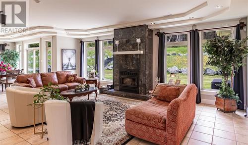 34 Marine Drive, Outer Cove Middle Cove Logy Bay, NL - Indoor Photo Showing Living Room With Fireplace