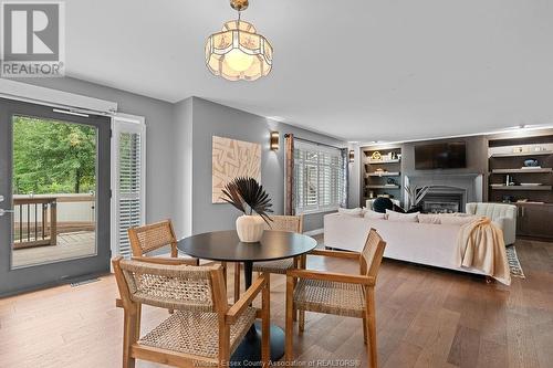 9585 Manitou Crescent, Windsor, ON - Indoor Photo Showing Dining Room With Fireplace