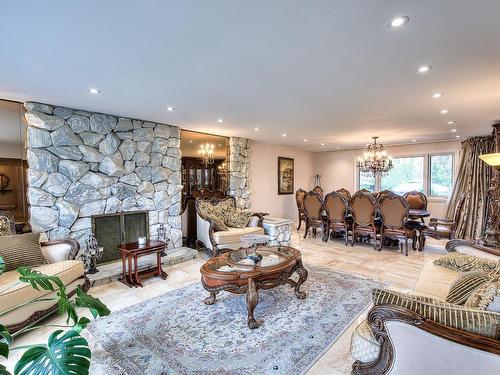 Salon - 19 Rue St-Judes, Laval (Chomedey), QC - Indoor Photo Showing Living Room With Fireplace