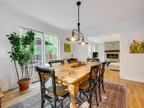 Dining room - 1534 Rue Michel-Blondin, Prévost, QC - Indoor Photo Showing Dining Room With Fireplace