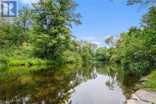 Swimming and paddling right across the road - 313 Noonan Side Road, Perth, ON - Outdoor With Body Of Water With View