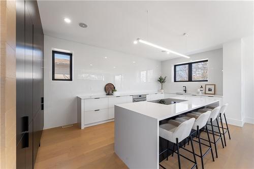 Kitchen. Quartz countertops. Thermador microwave fridge and freezer are hidden in black cabinetry to the left. - 5427 Anthony Place, Burlington, ON - Indoor