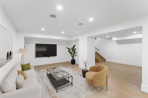 Lower level (virtually staged). Pot light, speakers. Adjacent bedroom, full bath, wine bar. - 5427 Anthony Place, Burlington, ON - Indoor Photo Showing Living Room