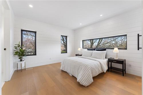 Master bedroom. Shiplap walls. - 5427 Anthony Place, Burlington, ON - Indoor Photo Showing Bedroom