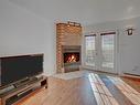 Hall d'entrÃ©e - 16089 Rue Victoria, Montréal (Rivière-Des-Prairies/Pointe-Aux-Trembles), QC  - Indoor Photo Showing Living Room With Fireplace 