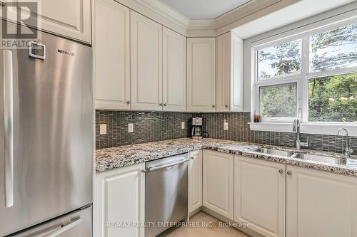 107 - 9909 Pine Valley Drive, Vaughan (Vellore Village), ON - Indoor Photo Showing Kitchen With Stainless Steel Kitchen With Double Sink