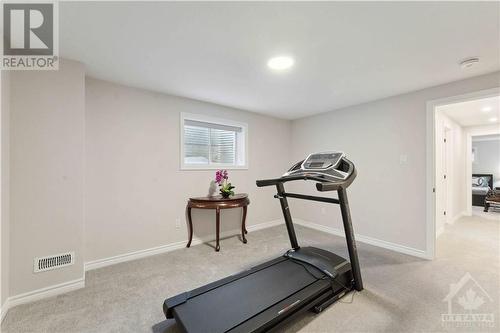 LOWER LEVEL 5TH BEDROOM - 79 Montology Way, Ottawa, ON - Indoor Photo Showing Gym Room