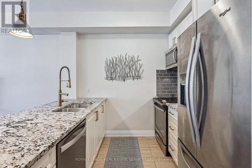 212 - 2375 Bronte Road E, Oakville (West Oak Trails), ON - Indoor Photo Showing Kitchen With Stainless Steel Kitchen With Double Sink With Upgraded Kitchen