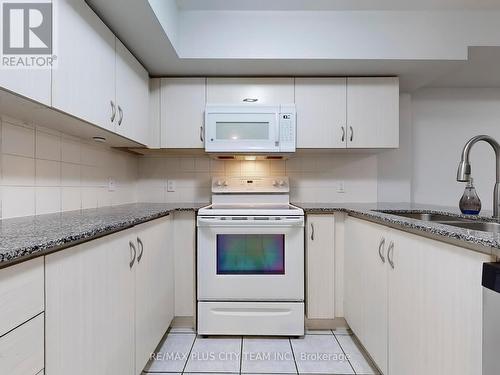 122 - 2441 Greenwich Drive, Oakville (West Oak Trails), ON - Indoor Photo Showing Kitchen With Double Sink