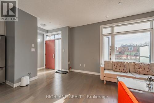 Th 9 - 4080 Parkside Village Drive, Mississauga, ON - Indoor Photo Showing Living Room