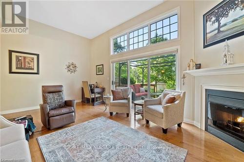 41 - 15 Lakeside Drive, St. Catharines, ON - Indoor Photo Showing Living Room With Fireplace