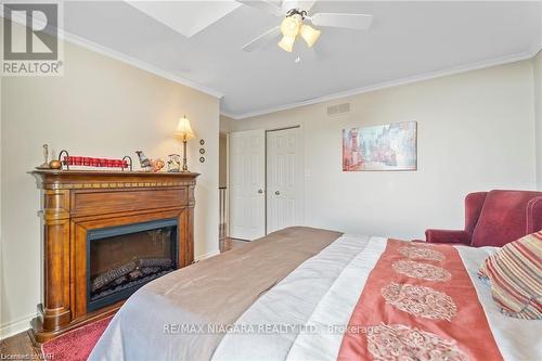 41 - 15 Lakeside Drive, St. Catharines, ON - Indoor Photo Showing Bedroom With Fireplace