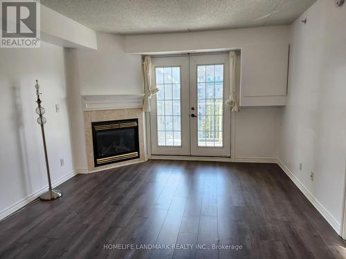 304 - 1440 Bishop Gate, Oakville, ON - Indoor Photo Showing Living Room With Fireplace