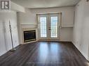 304 - 1440 Bishop Gate, Oakville, ON  - Indoor Photo Showing Living Room With Fireplace 