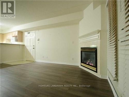 304 - 1440 Bishop Gate, Oakville, ON - Indoor With Fireplace