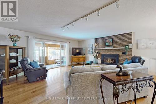 121 Queen Street, Kawartha Lakes, ON - Indoor Photo Showing Living Room With Fireplace