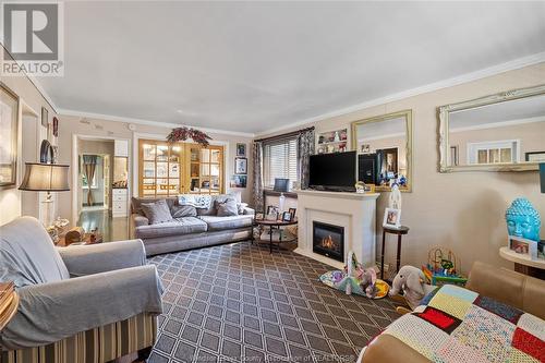 3655 Queen, Windsor, ON - Indoor Photo Showing Living Room With Fireplace