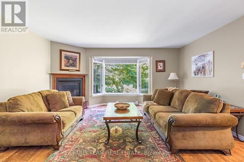 119 Silver Birch Drive, Tiny, ON - Indoor Photo Showing Living Room With Fireplace