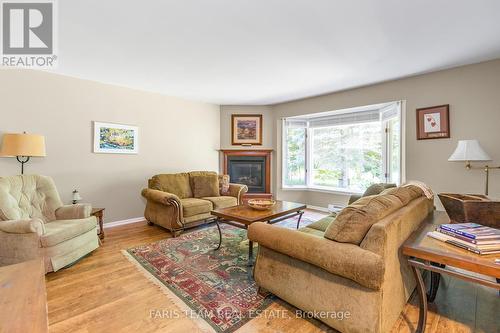 119 Silver Birch Drive, Tiny, ON - Indoor Photo Showing Living Room With Fireplace