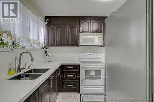 8 - 382 Driftwood Avenue, Toronto (Black Creek), ON - Indoor Photo Showing Kitchen With Double Sink