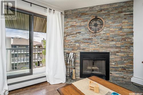 301B 55 Wood Lily Drive, Moose Jaw, SK - Indoor Photo Showing Living Room With Fireplace