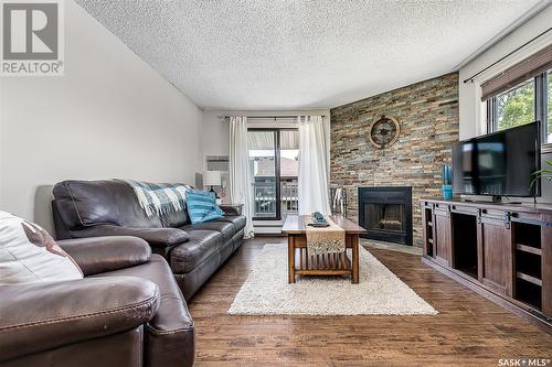 301B 55 Wood Lily Drive, Moose Jaw, SK - Indoor Photo Showing Living Room With Fireplace