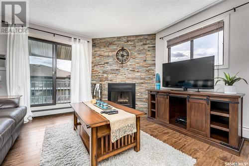 301B 55 Wood Lily Drive, Moose Jaw, SK - Indoor Photo Showing Living Room With Fireplace