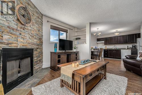 301B 55 Wood Lily Drive, Moose Jaw, SK - Indoor Photo Showing Living Room With Fireplace