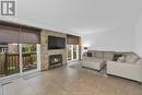 3933 Riverside Drive East, Windsor, ON  - Indoor Photo Showing Living Room With Fireplace 